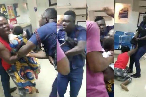 A policeman beats a woman carrying a baby in a bank (VIDEO)