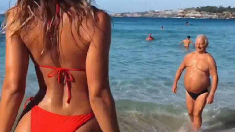Hilarious: man with beer belly steals the bikini model show