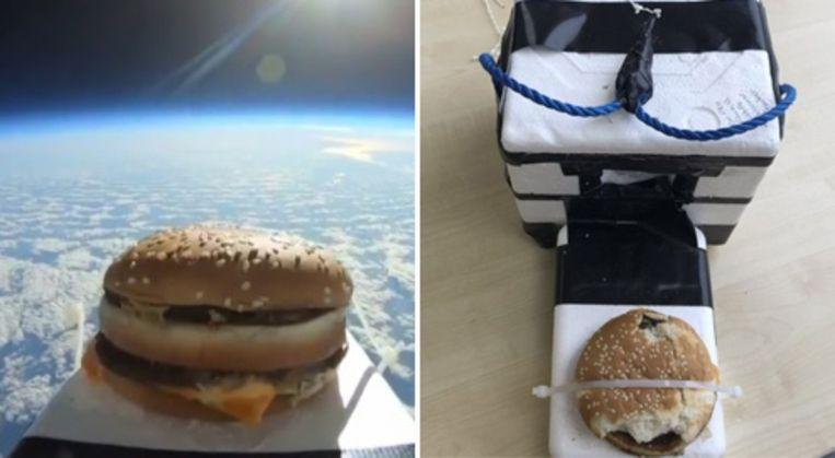 Soccer players find box from space with hamburger on the field