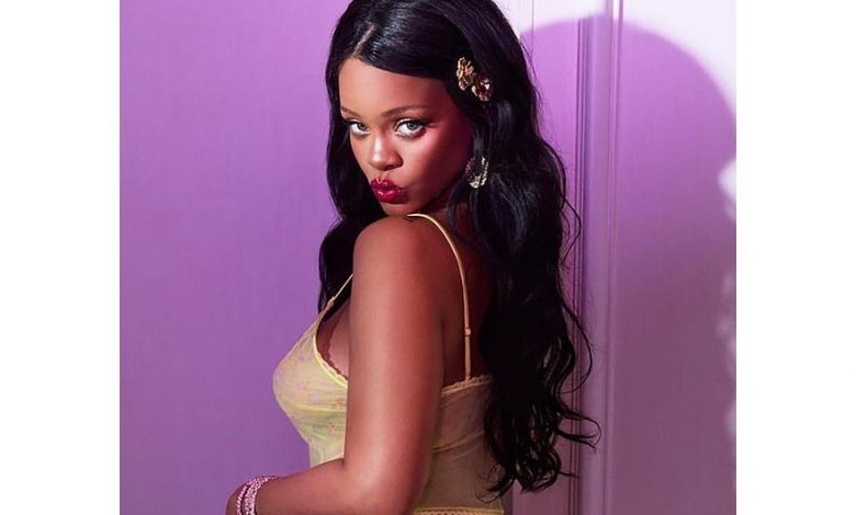 Rihanna shows her full-bodied butt and her tits in a yellow camisole and panties (Photos)