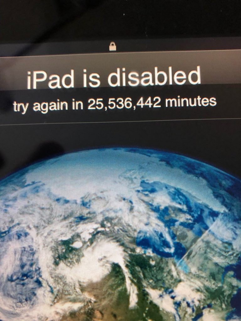 The iPad is disabled: "Try again after 48 years"