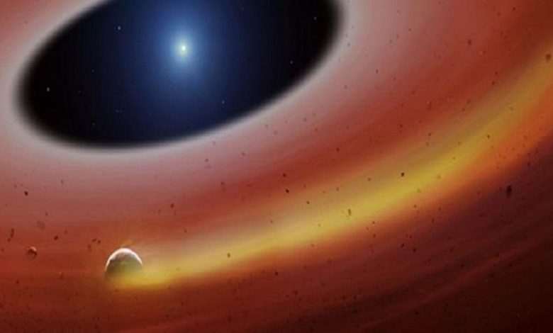 Planet in rubble disc discovered around 'dead star'