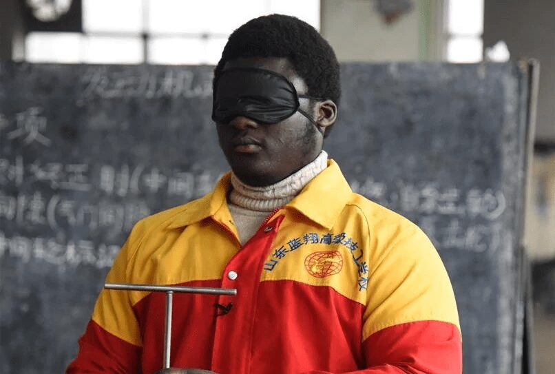 Thompson, the Ghanaian who works blindfolded in China