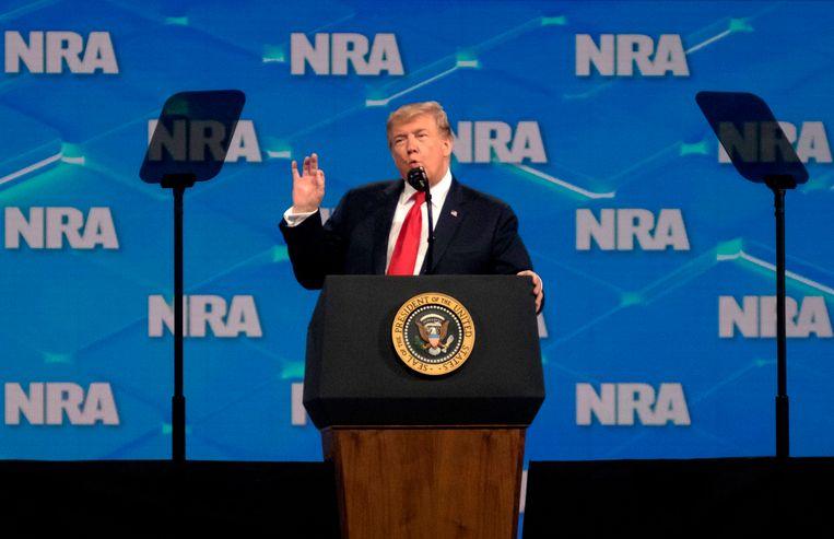 Cell phone thrower misses Trump at NRA meeting