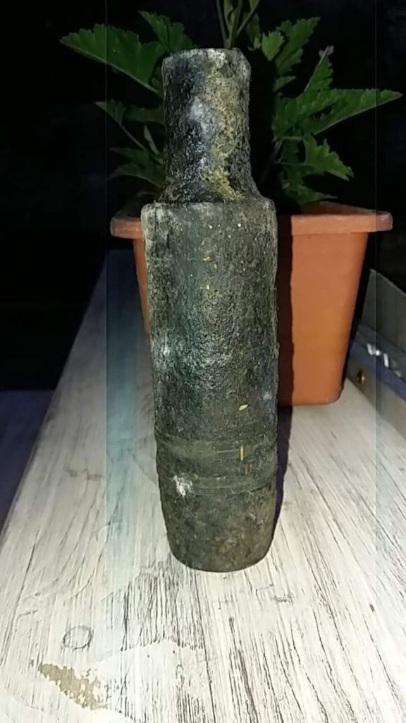 Magnet fisherman proudly comes home with a 'water bottle'.  It appears to be bomb from war 