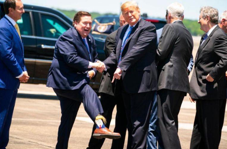 Billy Nungesser greets US President with bizarre (hairy) Trump socks