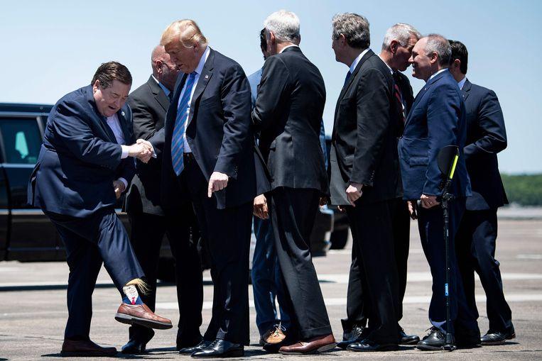 Deputy Governor greets American President with bizarre (hairy) Trump socks 