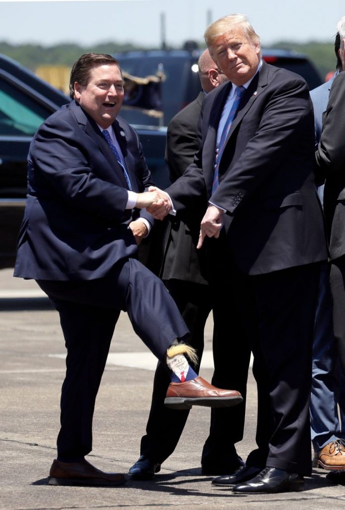 Deputy Governor greets American President with bizarre (hairy) Trump socks 