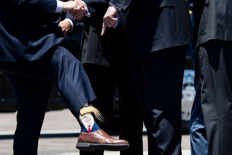 Deputy Governor greets American President with bizarre (hairy) Trump socks 