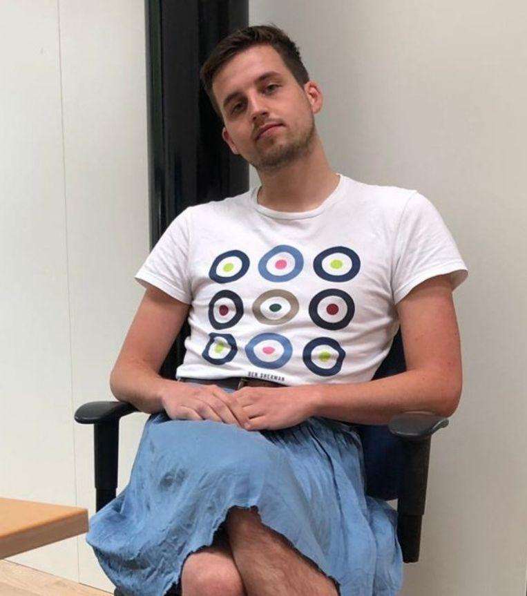 "Short not allowed", he wears a skirt to work