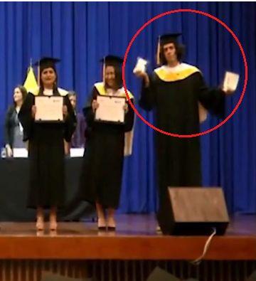 Young man destroys his diploma during graduation ceremony [Video]