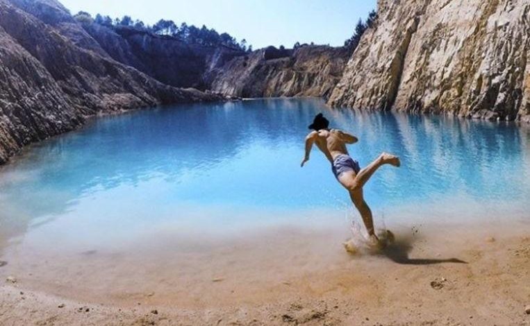 Instagrammers seriously ill after posing at toxic turquoise lake in Spain