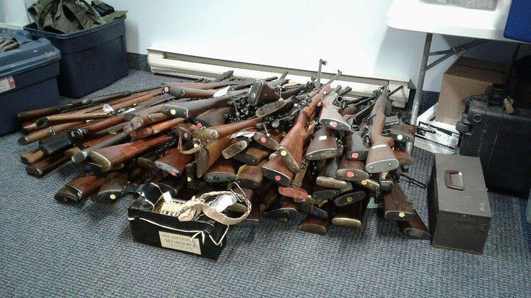 He accidentally calls 911 and arrested for 100 guns lying around