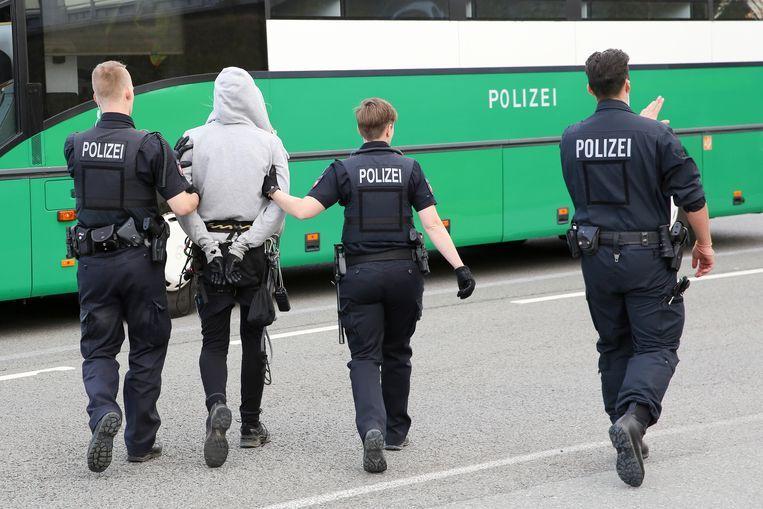 Climate protest ended where activists blocked train with VW cars