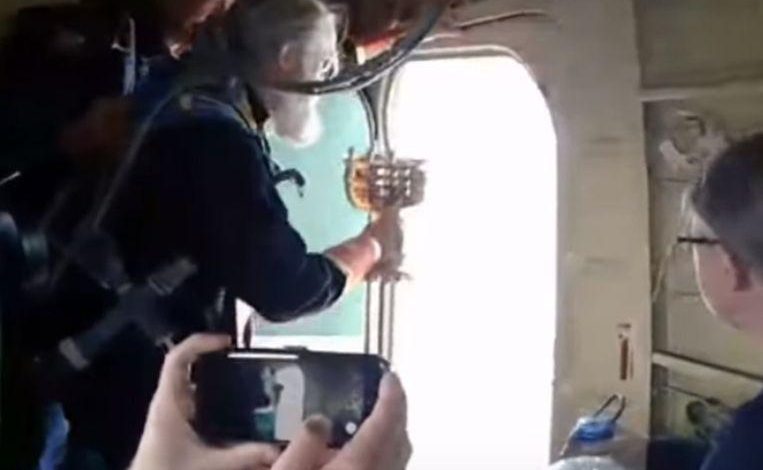 Russian priests sprinkle holy water from plane to cure alcoholism in the city