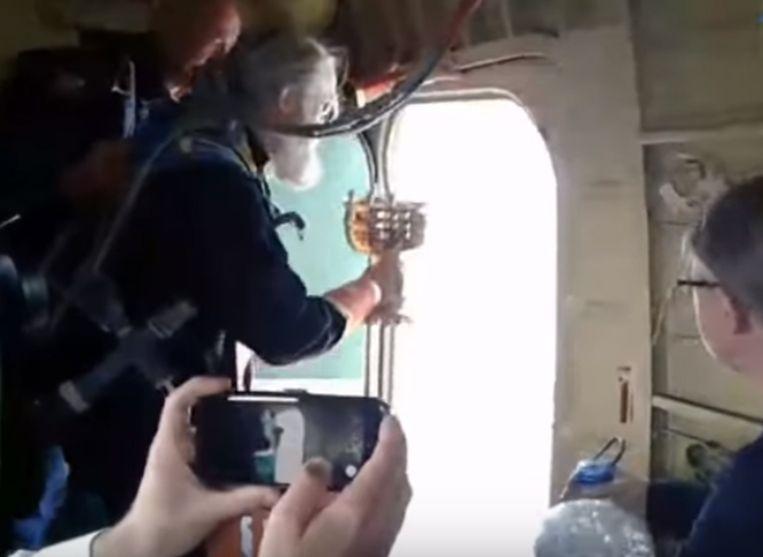 Russian priests sprinkle holy water from plane to cure alcoholism in the city