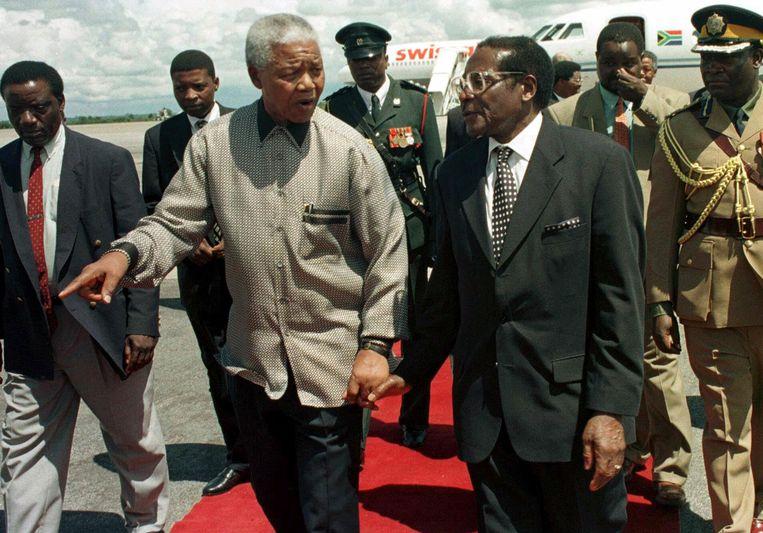 With former South African president Nelson Mandela in 1998.