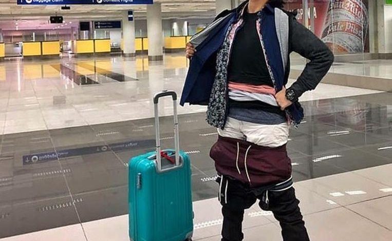 Filipino squeezes herself into 2.5 kilos of clothes to save extra costs on luggage