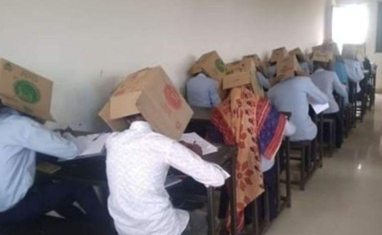 Students put carton box on the head during the exam