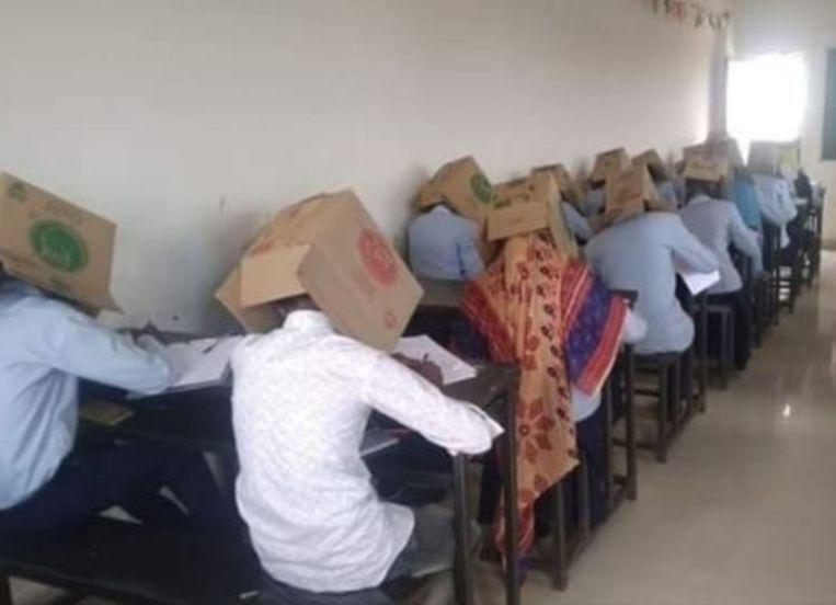 Students put carton box on the head during the exam
