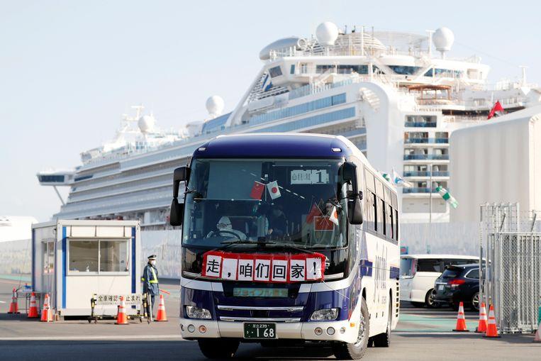 A bus with passengers who were allowed to leave the Diamond Princess