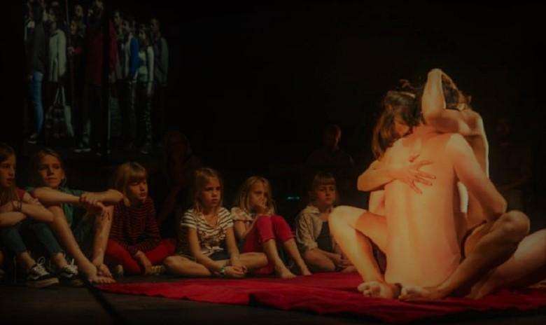 Saluting: actors make love for children in 'Lam Gods' play