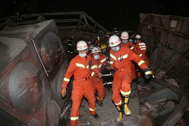 Rescuers evacuate an injured person from a collapsed hotel building in Quanzhou city in southeast China's Fujian province Saturday, March 07, 2020. The hotel used for medical observation of people who had contact with coronavirus patients collapsed in southeastern China on Saturday, trapping dozens, state media reported. (Chinatopix Via AP)