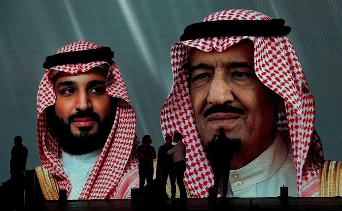 The Saudi king Salman (right) and his son and crown prince Mohammed bin Salman on a giant image in Jeddah, Saudi Arabia