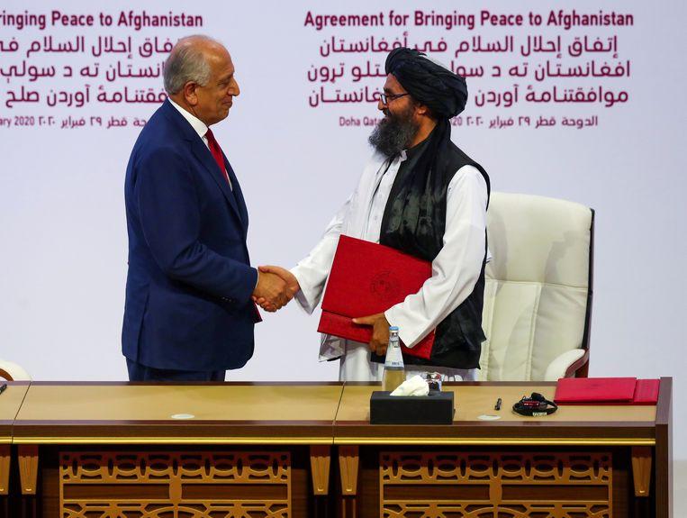 A representative from the United States and a Taliban leader at the drawing of the peace agreement on Saturday.