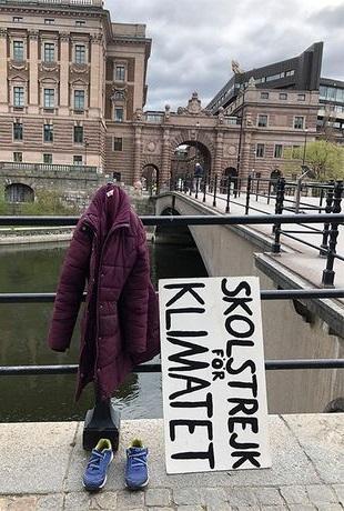 Greta Thunberg campaigning for climate change in adapted form 
