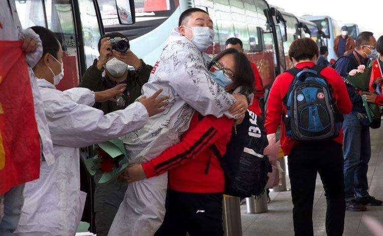 Wuhan rejoices end of lockdown with light show but worries not over yet