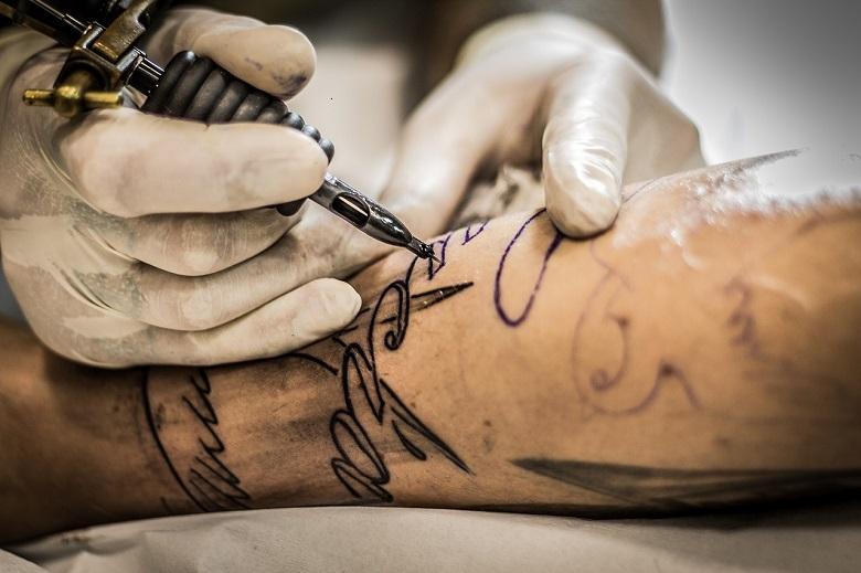 American tattoo artist removes racist tattoos for free