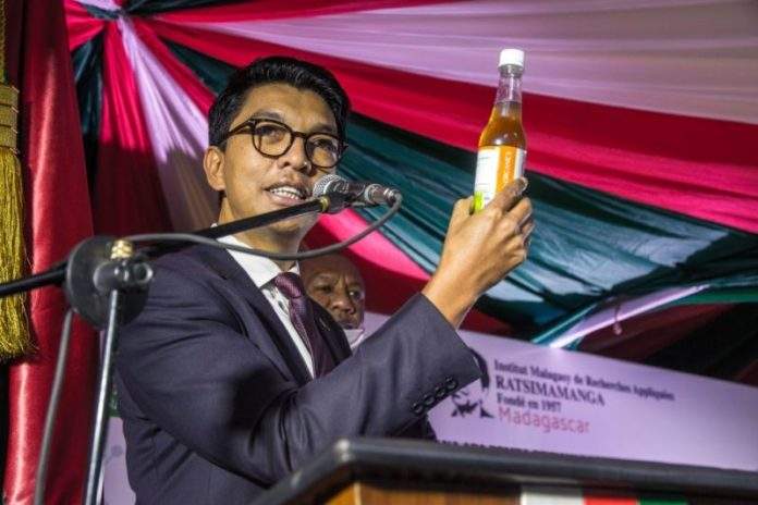 President of Madagascar, Andry Rajoelina with a dose of Covid-Organics