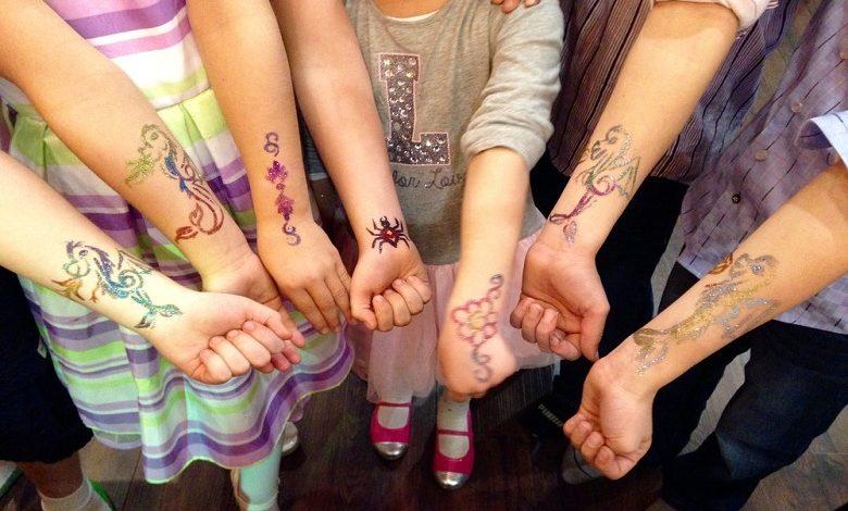 Tired of bad summer weather? Entertain your kids with a fake tattoo