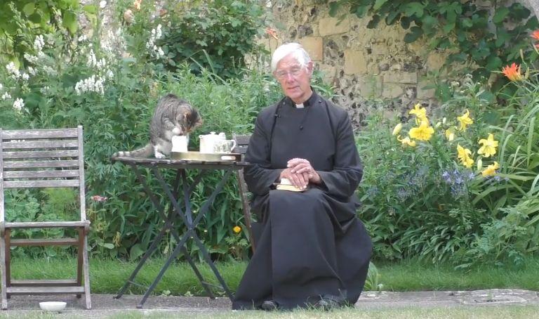 While Priest is preaching, cat is seriously lapping his milk [video]