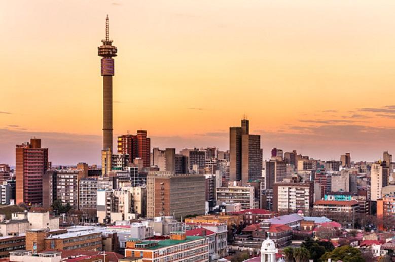 Johannesburg sunrise with Telkom communications tower cityscape.