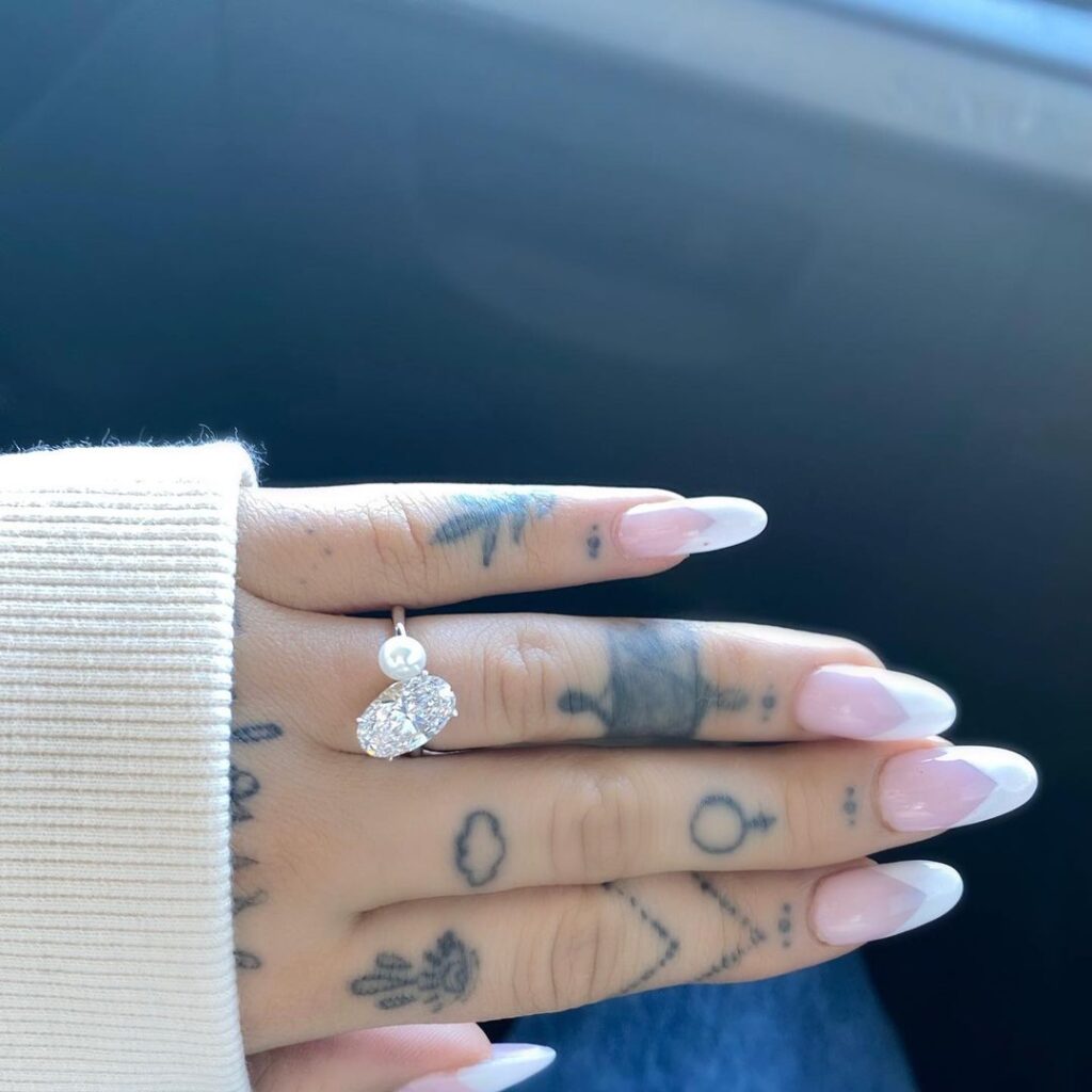 a photo of her diamond engagement ring, which she received from her boyfriend, Dalton Gomez
