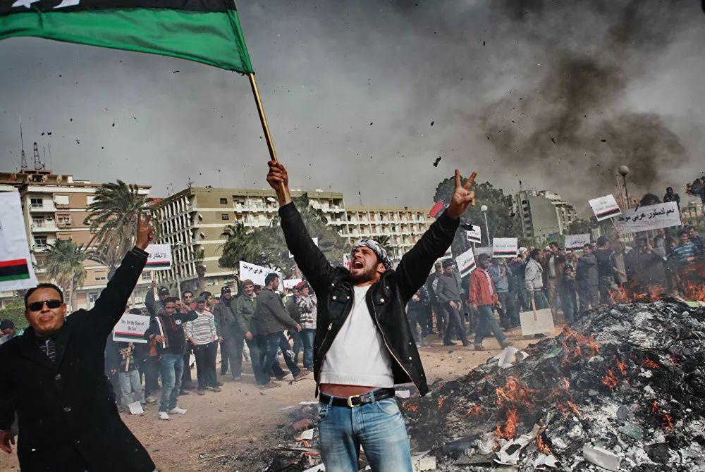 From Tunisia, the wave of unrest spread to Algeria, Jordan, Egypt, and Yemen, and then to other countries. Pictured: Benghazi’s residents, <a href=