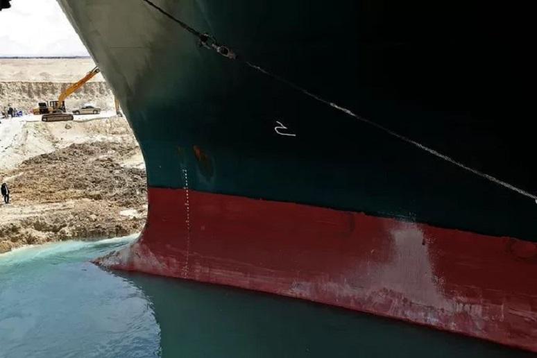 Stuck ship in Suez Canal may already be loose tonight