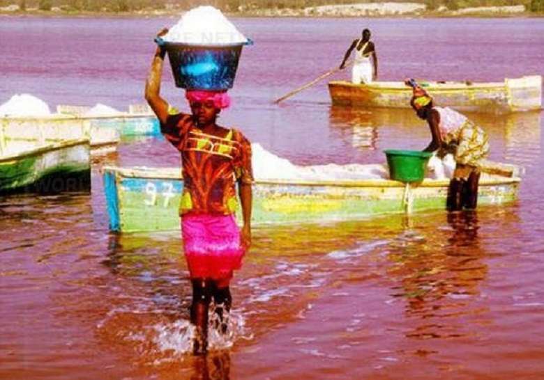 People extracting salt from lake rebta