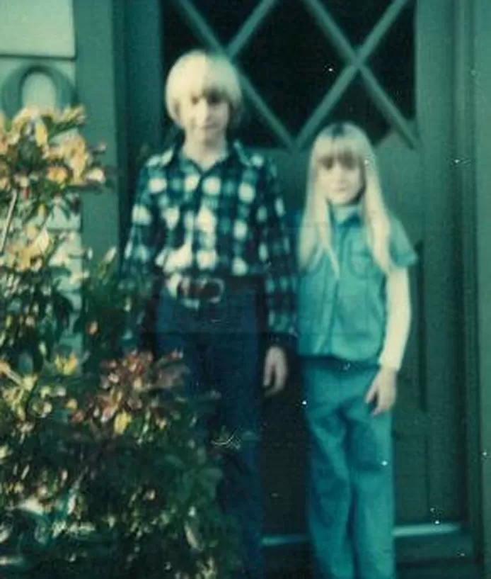 Kurt Cobain and his sister Kim at the front door of the family home.