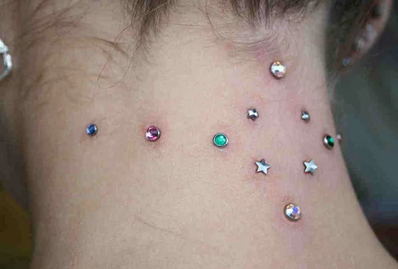 What are body modifications other than piercings and tattoos?