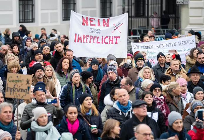 Austrians protest against the new measure at the Federal Chancellery in Vienna.