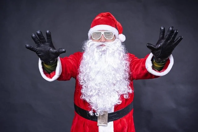 Is Santa real and how does the iconic image of Santa Claus appear?