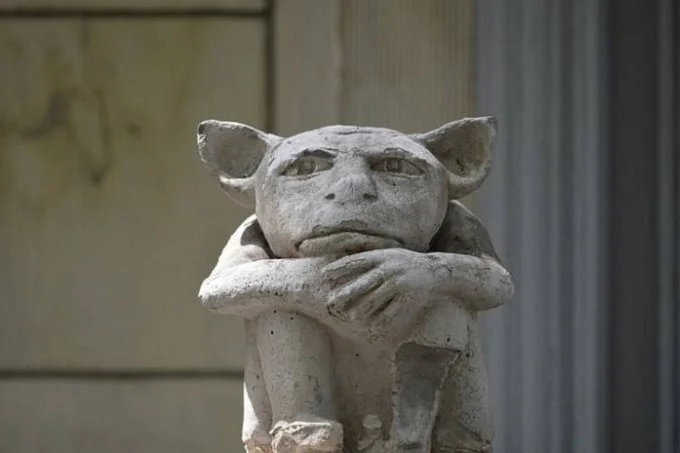 Gargoyles from the rooftops: Why do people put it in front of their house?