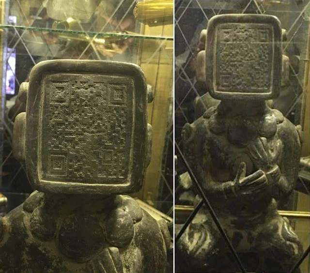 Qr-code on the face of the Mayan statue