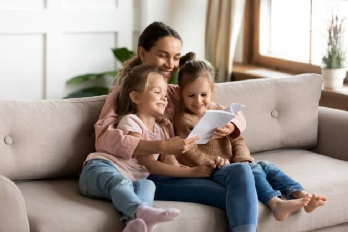 A wise woman helping her children with studies