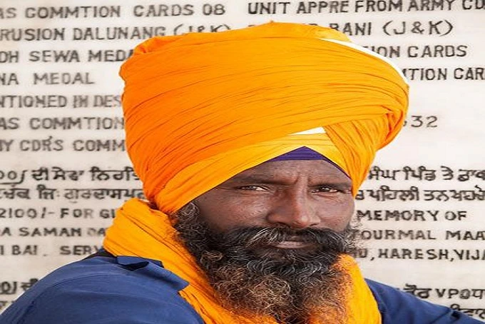 Why do Sikhs wear turbans