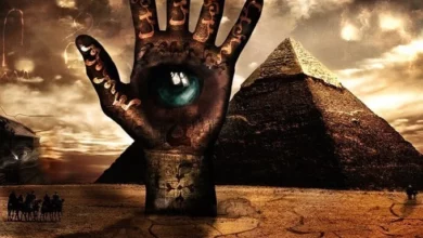 What does the pyramid with an eye symbolize?