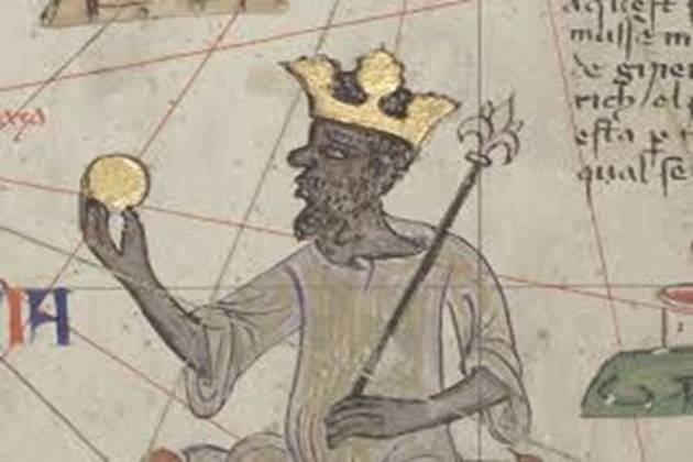 The ruler of Mali, Mansa Musa, holding a gold nugget
